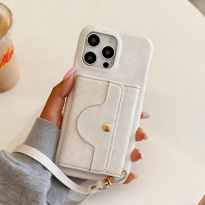 Hand holding a beige phone case with a strap on a light background